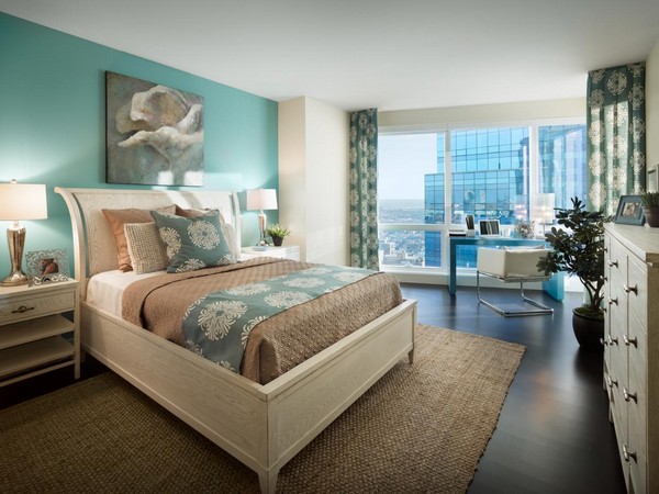 Use of blue adds charm to this tan bedroom