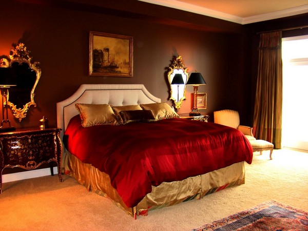 Tan bedroom that uses red as an accent color