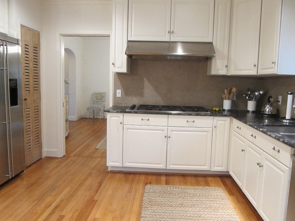 White kitchen with dark grey fridge and countertops